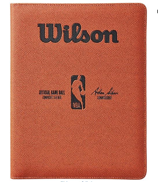 Basketball with Wilson branding and NBA logo on a brown background