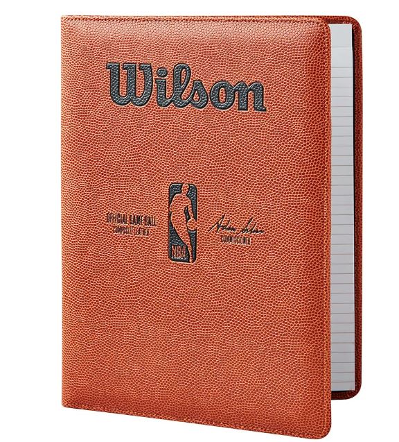 Notebook made from a recycled basketball with Wilson branding on a white background